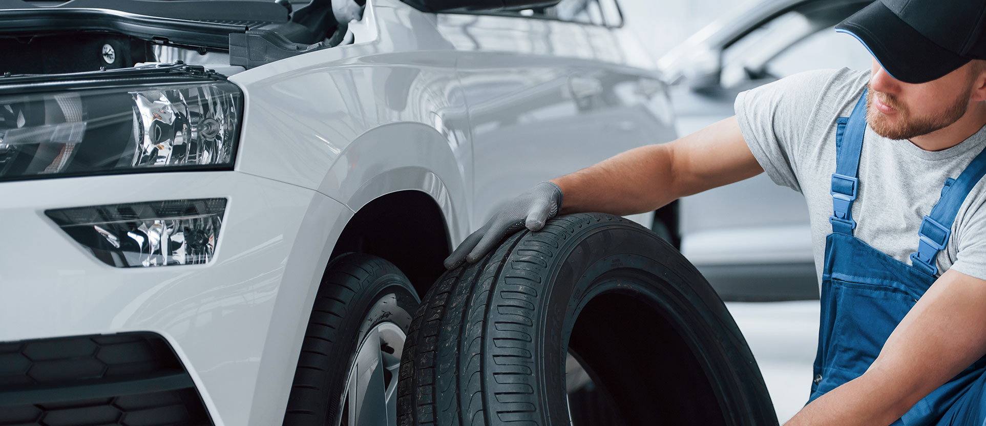 Man inspecting tire banner-3