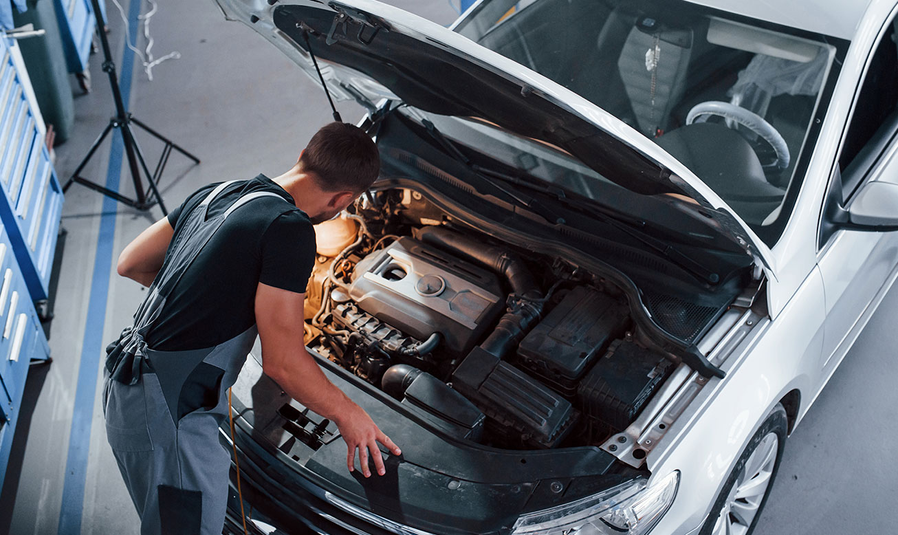 Man inspecting car service-3