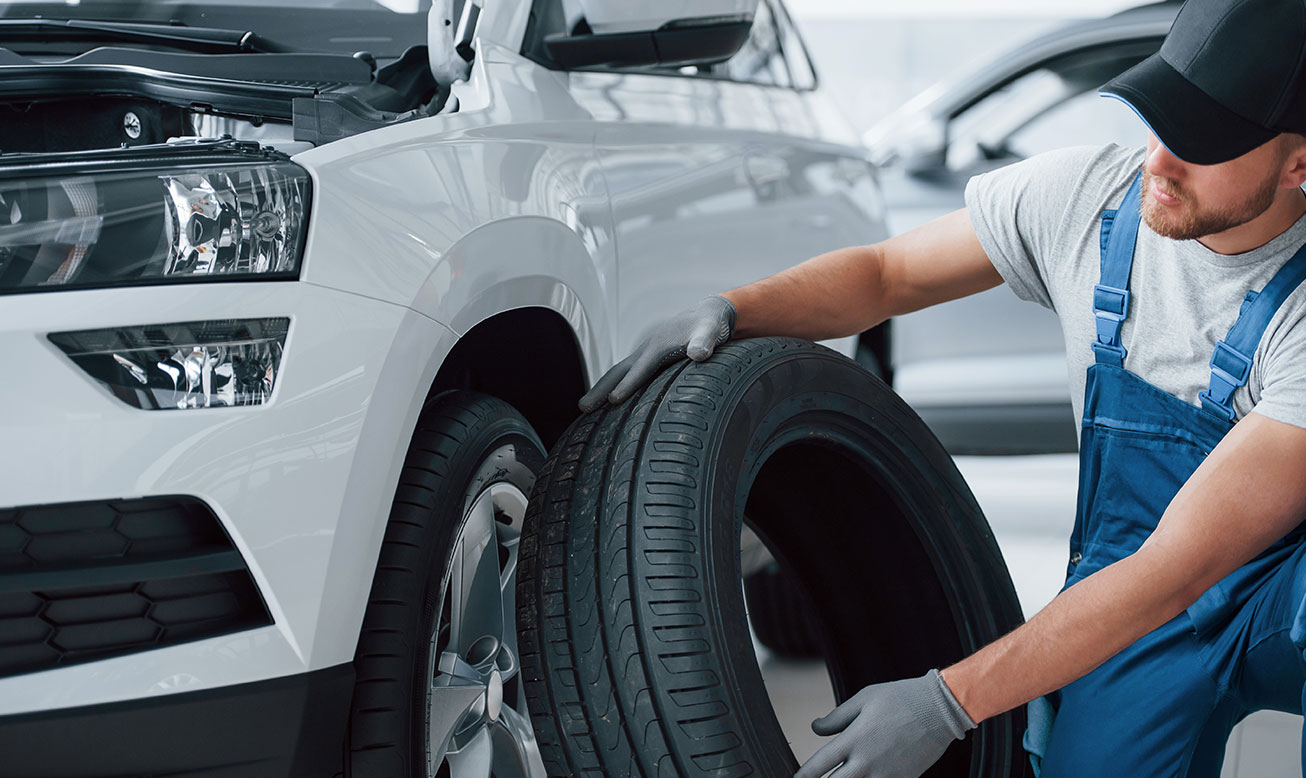 Man inspecting tire service-4